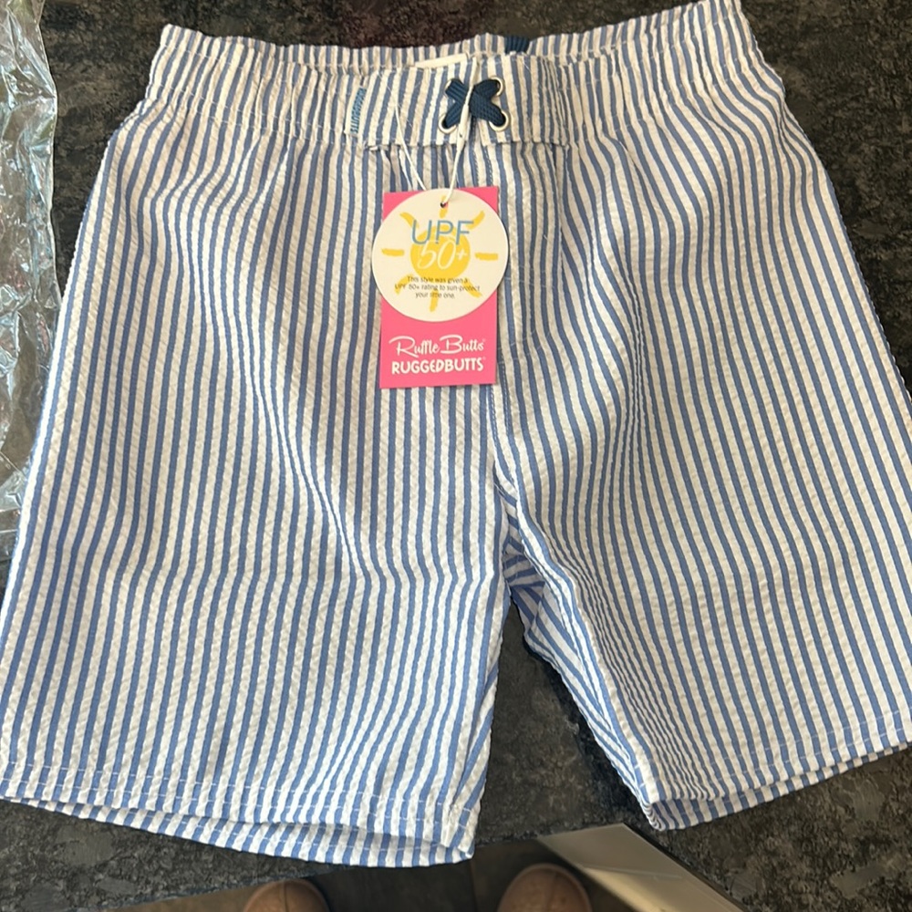 Ruffle butts seersucker swim trunks
